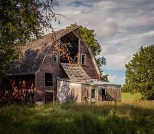 House on field against sky