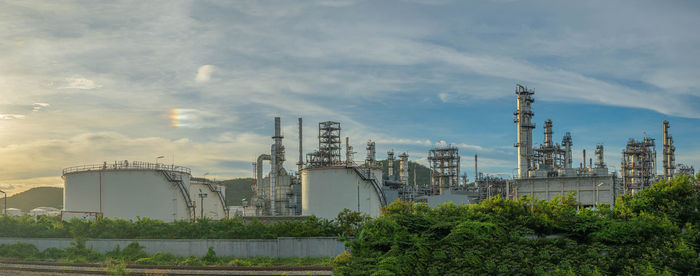 View of factory against cloudy sky