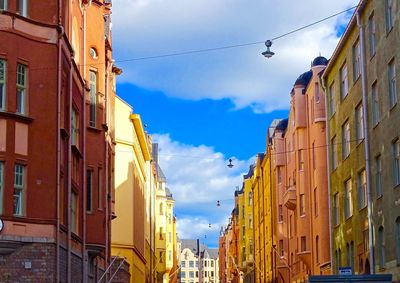 Low angle view of buildings against sky in city