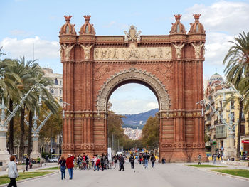 Tourists in front of historical structure