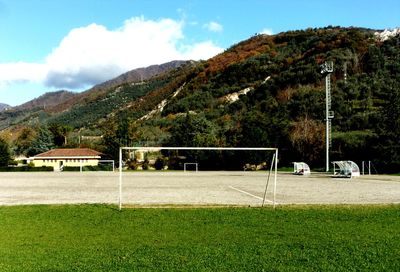 Scenic view of soccer field against sky