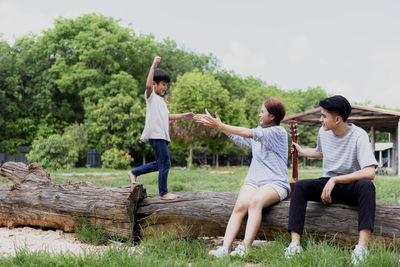 Parents sitting with son at park