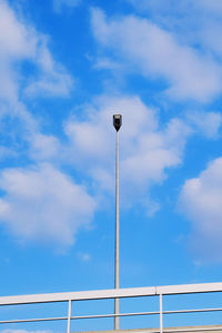 Low angle view of street light against sky