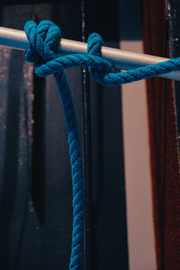 Close-up of rope tied on metal