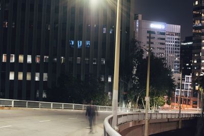 Buildings in city at night