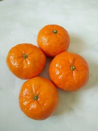 High angle view of orange fruit on table