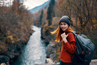 Young woman standing on snow covered mountain