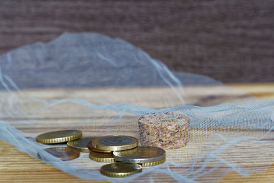 Close-up of coins on table