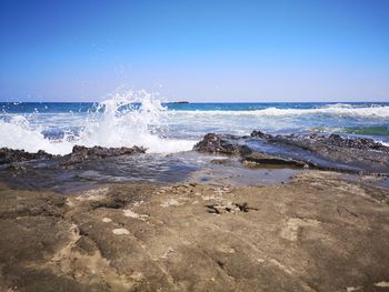 Scenic view of sea against clear sky