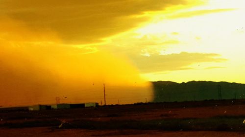 Scenic view of landscape at sunset