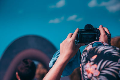 Rear view of photographer photographing