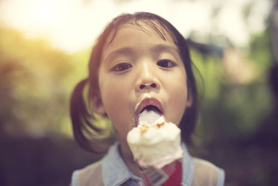 Portrait of cute girl eating ice cream