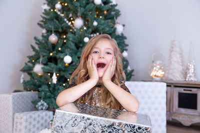 Portrait of girl with christmas tree