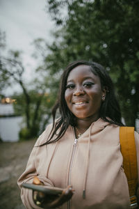 Portrait of teenage girl holding smart phone