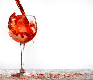 Close-up of wineglass on glass