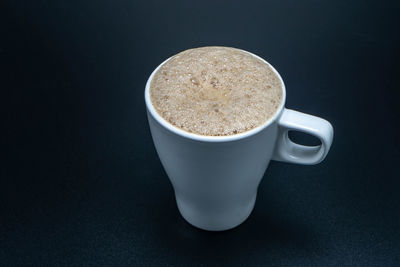 High angle view of coffee cup on table
