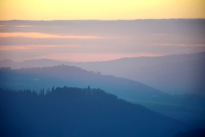 Scenic view of silhouette mountain against sky during sunset