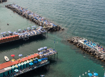 High angle view of people on pier at harbor