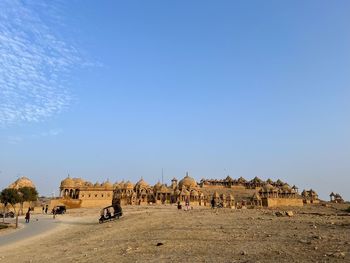 Scenic view of beach against clear blue sky