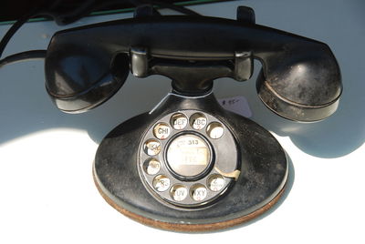 Close-up of old landline phone on table