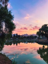 Scenic view of lake against sky during sunset