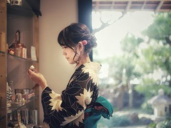 Portrait of woman standing outdoors