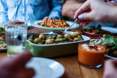 Close-up of friends having food at restaurant