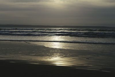 Scenic view of sea against dramatic sky