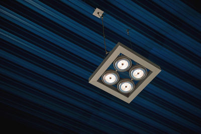 Low angle view of illuminated ceiling lamp