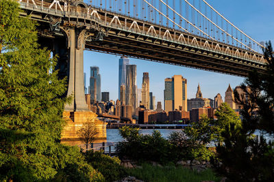 View of bridge and buildings against sky