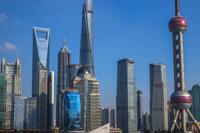 Skyscrapers in city against clear sky