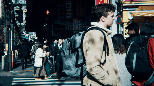 People on city street at night