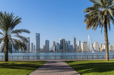 Modern buildings in city against clear sky