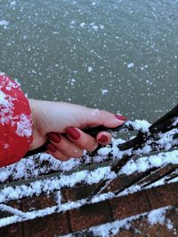 Cropped hand of woman holding ice cream