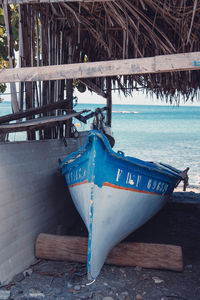 Deck chairs on pier at beach