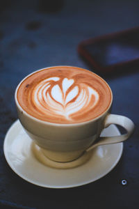 Close-up of cappuccino on table