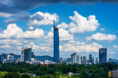 Modern buildings in city against sky