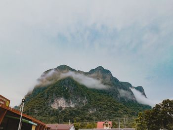 Scenic view of rainbow over mountain against sky