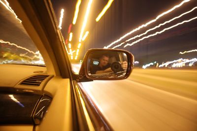 Close-up of car on road at night