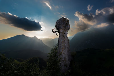 Scenic view of rocks against sky during sunset