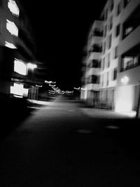 Illuminated street lights in city at night