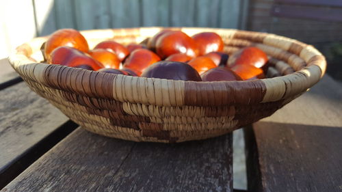 Close-up of fruits in basket on table