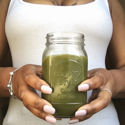 Midsection of woman holding drink