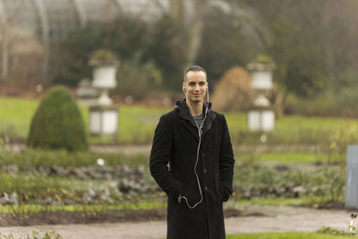 Portrait of young man standing outdoors