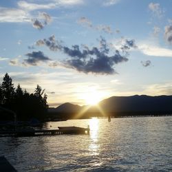 Scenic view of river at sunset