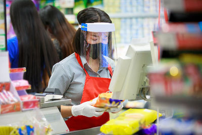 Women standing on display at store