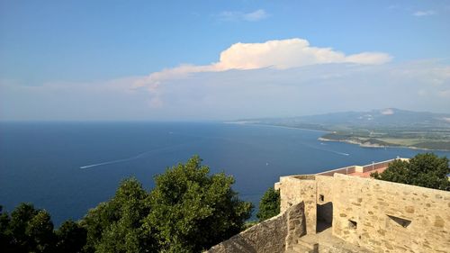 High angle view of sea and buildings against sky