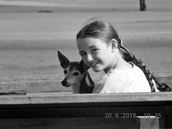 Portrait of cute girl with dog