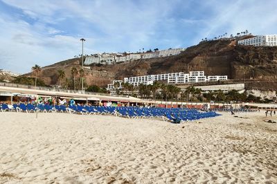 Panoramic view of beach against buildings