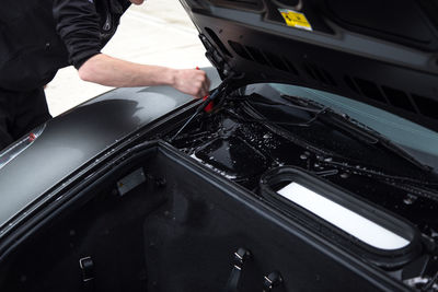 High angle view of man working on car